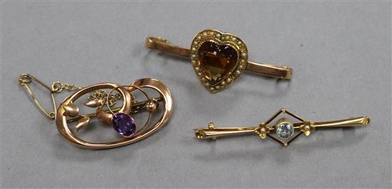 An Edwardian 15ct gold and gem set bar brooch and two 9ct gold and gem set bar brooches.